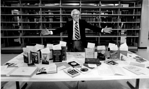 Ray Bradbury in front of an array of his books.